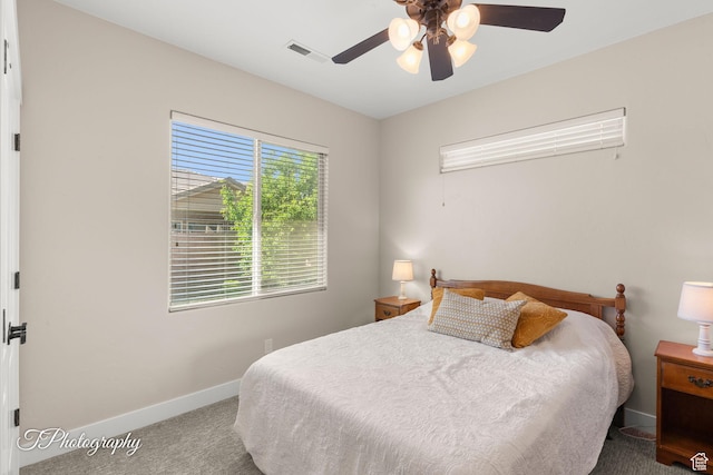 bedroom with ceiling fan, baseboards, visible vents, and carpet floors