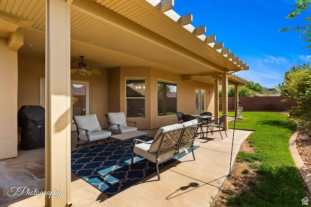 view of patio with ceiling fan and fence