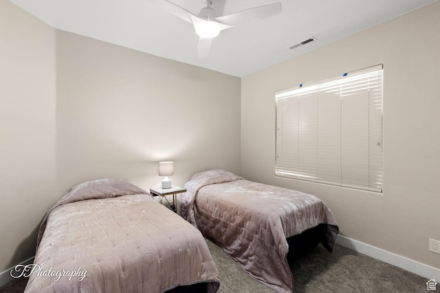 carpeted bedroom with ceiling fan, baseboards, and visible vents