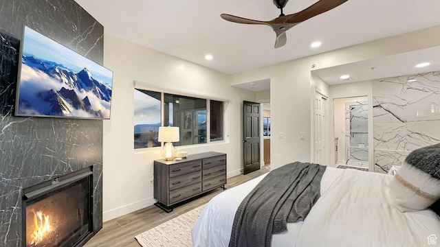 3000 Canyons Resort Dr Unit 4600, Park City, UT 84098 - bedroom with wood finished floors, a fireplace, baseboards, and recessed lighting