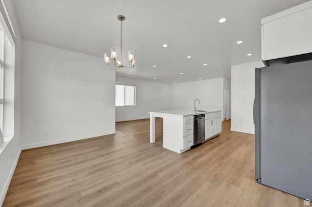 578 S 1080 W, American Fork, UT 84003 - kitchen featuring a notable chandelier, open floor plan, white cabinets, appliances with stainless steel finishes, and a sink