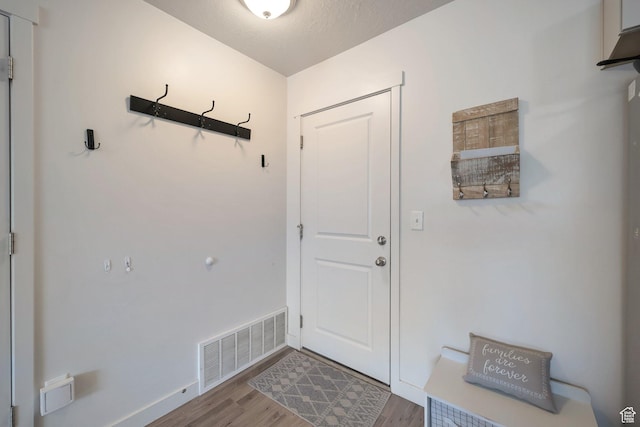 172 E Legacy Pkwy, Saratoga Springs, UT 84045 - doorway with baseboards, wood finished floors, and visible vents