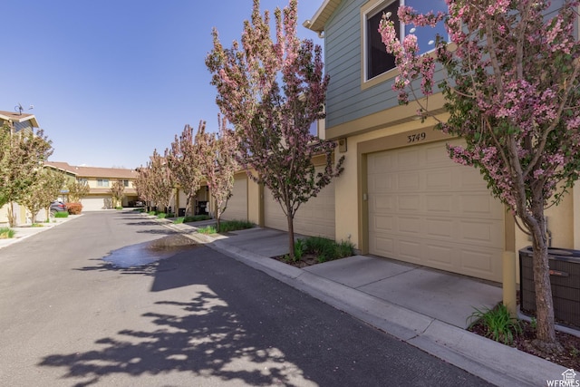 view of front of house featuring central AC and stucco siding