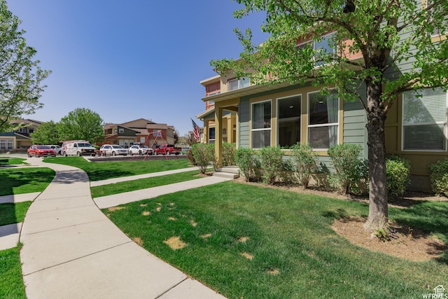 view of front of property featuring a residential view and a front lawn