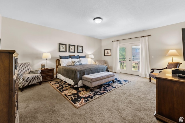 carpeted bedroom featuring french doors and access to exterior
