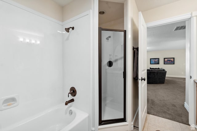 bathroom featuring combined bath / shower with glass door, tile patterned flooring, visible vents, and baseboards