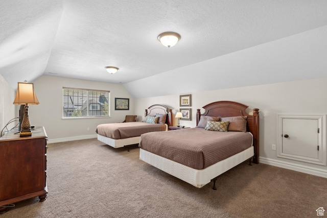 bedroom featuring baseboards, a textured ceiling, carpet flooring, and lofted ceiling