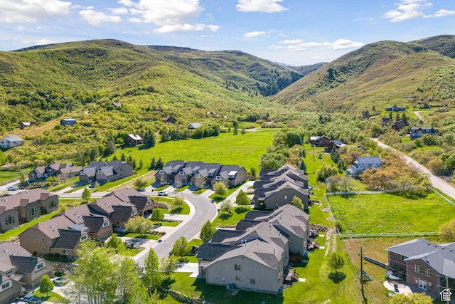 birds eye view of property featuring a mountain view and a residential view
