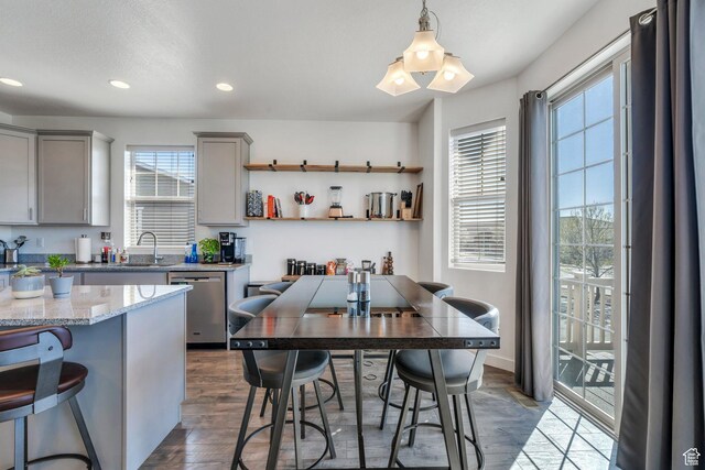 42 S 1060 W, Spanish Fork, UT 84660 - kitchen with dishwasher, a kitchen bar, dark wood-style floors, recessed lighting, and gray cabinets