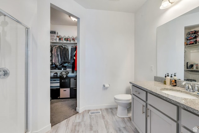 42 S 1060 W, Spanish Fork, UT 84660 - bathroom featuring a shower stall, a walk in closet, vanity, and wood finished floors