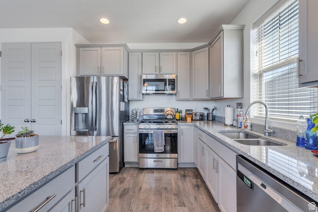 42 S 1060 W, Spanish Fork, UT 84660 - kitchen featuring gray cabinets, appliances with stainless steel finishes, a sink, and light stone countertops