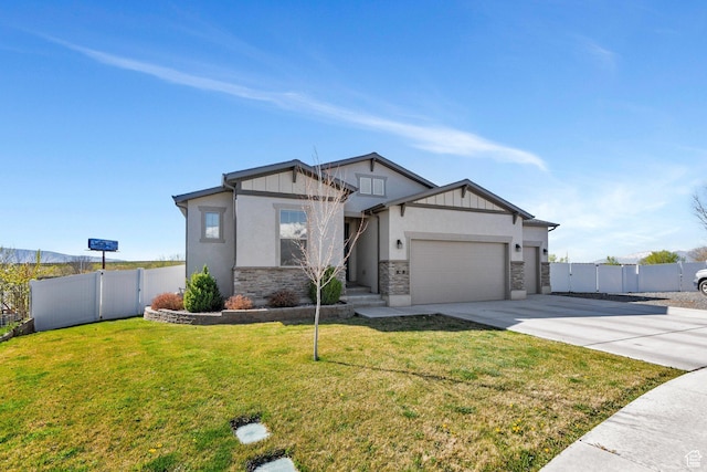 42 S 1060 W, Spanish Fork, UT 84660 - view of front of home with a garage, driveway, fence, and a front lawn