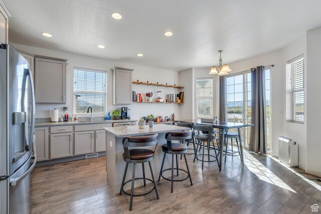 42 S 1060 W, Spanish Fork, UT 84660 - kitchen featuring stainless steel fridge with ice dispenser, gray cabinets, plenty of natural light, and a sink