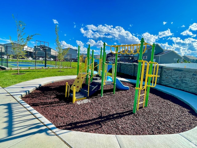 community jungle gym featuring a residential view and fence