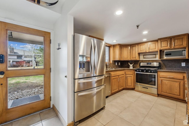 1450 Deer Valley Dr N, Park City, UT 84060 - kitchen featuring tasteful backsplash, light tile patterned floors, dark countertops, and stainless steel appliances
