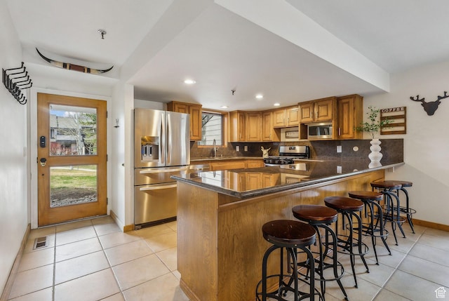 1450 Deer Valley Dr N, Park City, UT 84060 - kitchen with baseboards, light tile patterned floors, visible vents, appliances with stainless steel finishes, and a sink