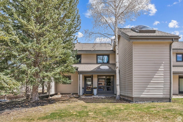 1450 Deer Valley Dr N, Park City, UT 84060 - rear view of house with roof with shingles and a lawn