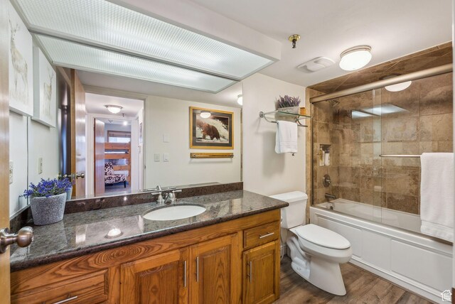 1450 Deer Valley Dr N, Park City, UT 84060 - full bathroom with combined bath / shower with glass door, toilet, vanity, and wood finished floors