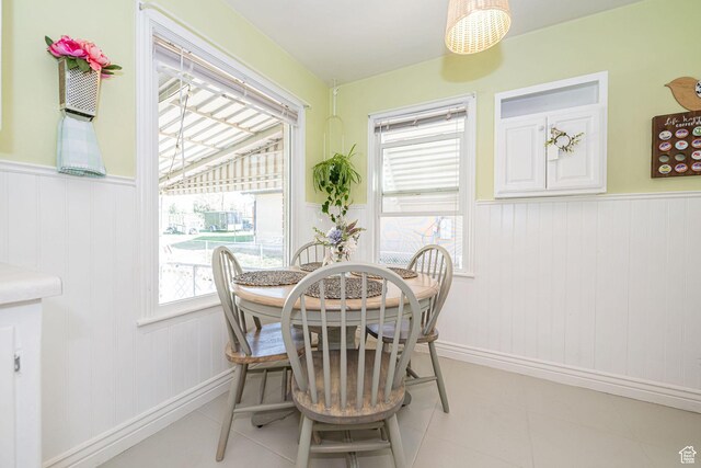 dining room featuring wainscoting and baseboards