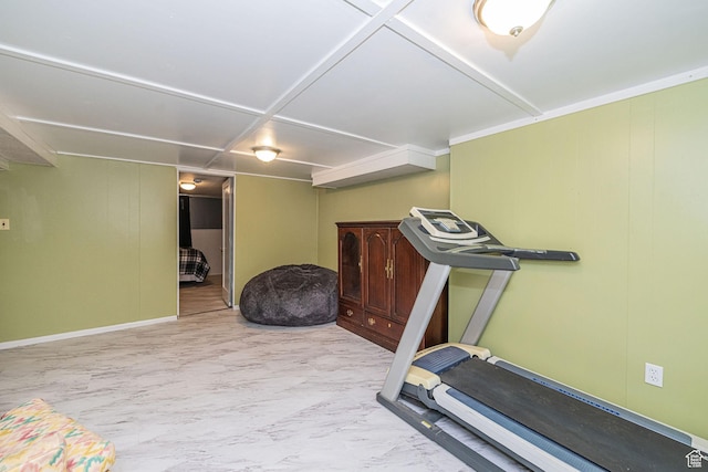 exercise room featuring baseboards