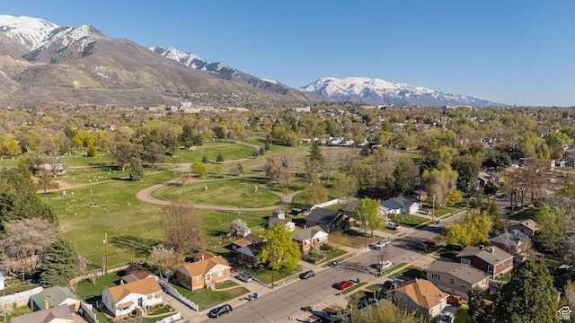 drone / aerial view featuring a residential view and a mountain view