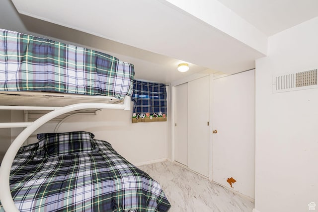 bedroom with visible vents and baseboards