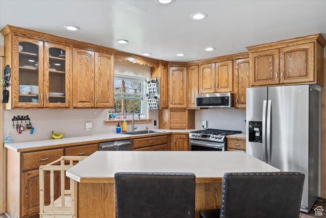 400 S 300 E, Pleasant Grove, UT 84062 - kitchen featuring glass insert cabinets, a sink, light countertops, recessed lighting, and stainless steel appliances