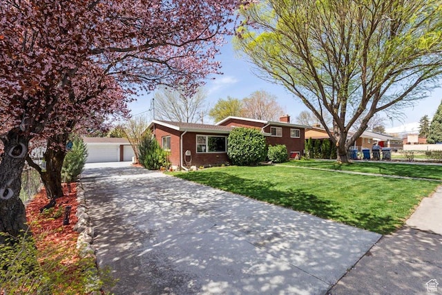 400 S 300 E, Pleasant Grove, UT 84062 - view of front of home with a detached garage, an outdoor structure, a front yard, brick siding, and a chimney