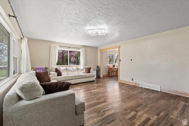 400 S 300 E, Pleasant Grove, UT 84062 - living area with visible vents, baseboards, wood finished floors, and a textured ceiling