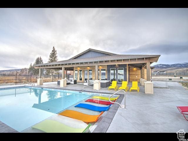 55 E Buttercup Ln Unit 42, Garden City, UT 84028 - view of pool featuring an exterior structure, an outdoor structure, a patio area, fence, and a fenced in pool