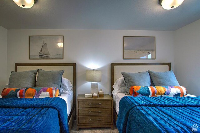 55 E Buttercup Ln Unit 42, Garden City, UT 84028 - bedroom with light carpet and a textured ceiling