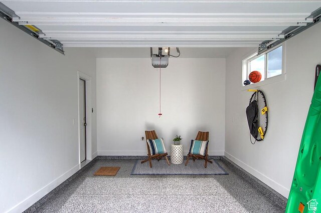 55 E Buttercup Ln Unit 42, Garden City, UT 84028 - garage with baseboards and a garage door opener