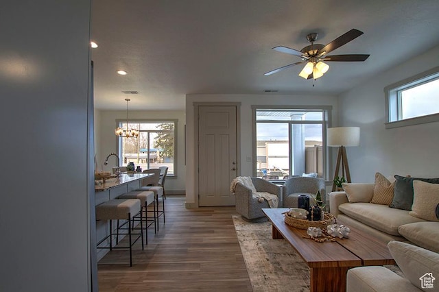 55 E Buttercup Ln Unit 42, Garden City, UT 84028 - living area featuring wood finished floors, ceiling fan with notable chandelier, plenty of natural light, and recessed lighting