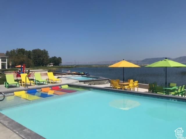 55 E Buttercup Ln Unit 42, Garden City, UT 84028 - community pool featuring a patio area and a water view