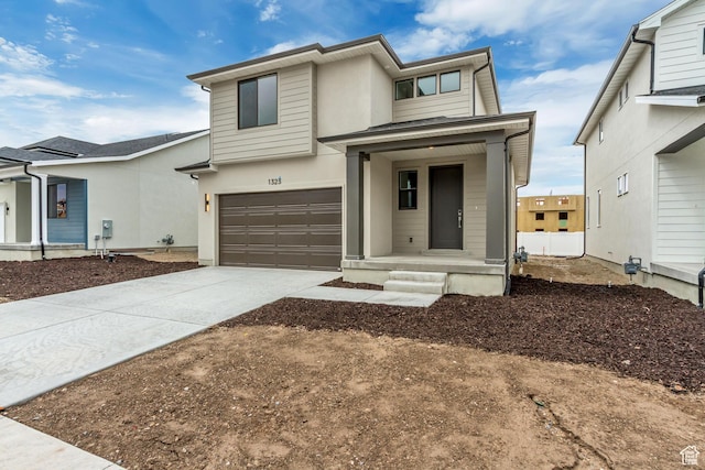 view of front of home with an attached garage and driveway