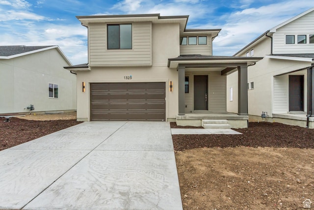 view of front facade featuring an attached garage and driveway