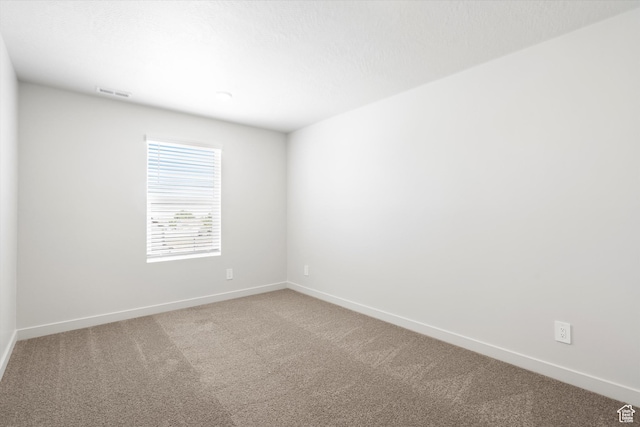 1345 N Harper Way Unit 0250, Tooele, UT 84074 - spare room featuring carpet and baseboards