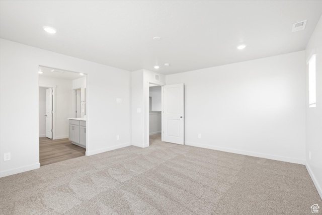 1345 N Harper Way Unit 0250, Tooele, UT 84074 - empty room featuring light carpet and recessed lighting