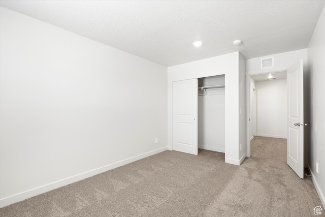 1345 N Harper Way Unit 0250, Tooele, UT 84074 - unfurnished bedroom featuring light colored carpet and a closet