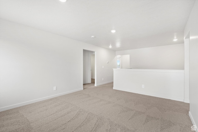 1345 N Harper Way Unit 0250, Tooele, UT 84074 - spare room featuring light colored carpet and recessed lighting