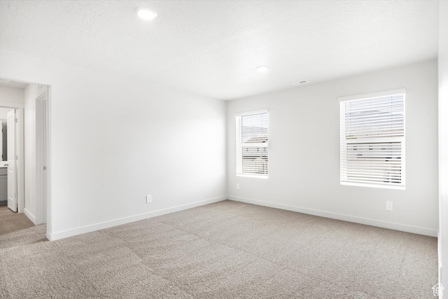 1345 N Harper Way Unit 0250, Tooele, UT 84074 - unfurnished room featuring light carpet and recessed lighting