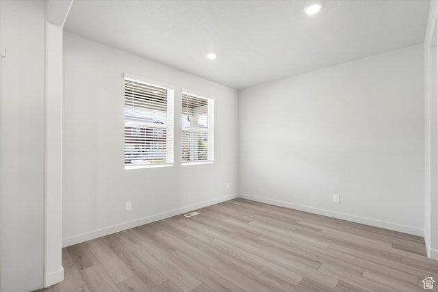 1345 N Harper Way Unit 0250, Tooele, UT 84074 - spare room with light wood-style flooring and recessed lighting