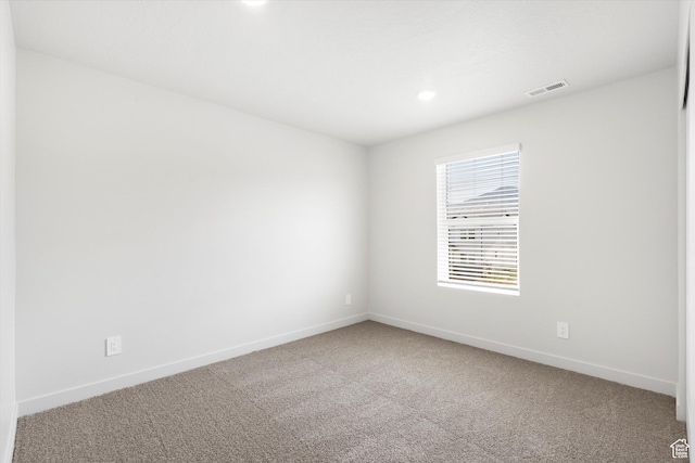 1345 N Harper Way Unit 0250, Tooele, UT 84074 - empty room featuring carpet flooring and recessed lighting