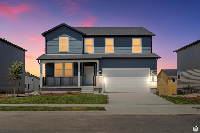 1345 N Harper Way Unit 0250, Tooele, UT 84074 - view of front of home with a porch, an attached garage, driveway, roof with shingles, and a front lawn