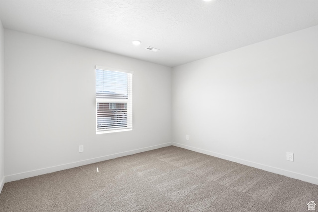 1345 N Harper Way Unit 0250, Tooele, UT 84074 - carpeted empty room featuring baseboards