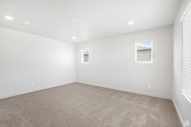 1345 N Harper Way Unit 0250, Tooele, UT 84074 - spare room featuring light colored carpet and recessed lighting