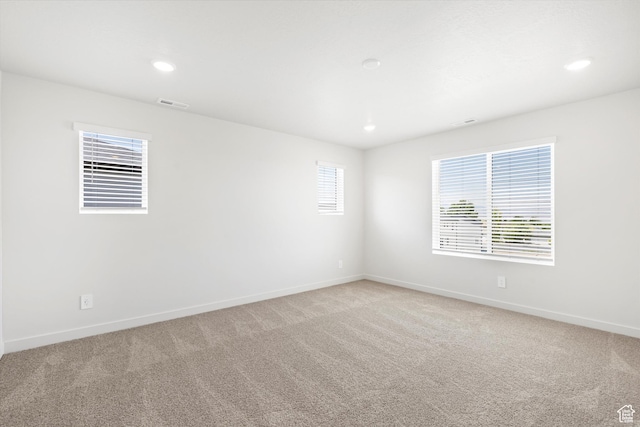 1345 N Harper Way Unit 0250, Tooele, UT 84074 - spare room featuring light carpet and recessed lighting