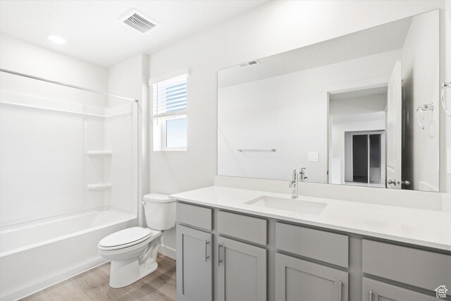1345 N Harper Way Unit 0250, Tooele, UT 84074 - full bathroom featuring vanity, wood finished floors, and bathtub / shower combination