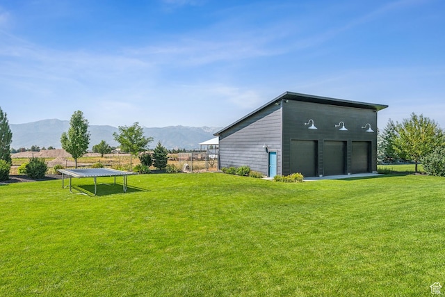 2154 E 1340 S, Heber City, UT 84032 - view of yard with a mountain view, a trampoline, a garage, and fence