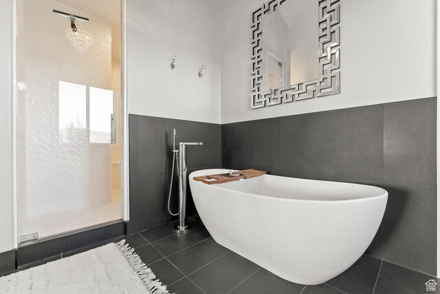 2154 E 1340 S, Heber City, UT 84032 - full bath with tile patterned floors, a freestanding tub, tile walls, and a wainscoted wall